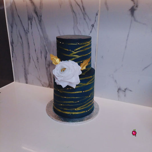 2 Tier Navy and Gold Cake with a big white rose