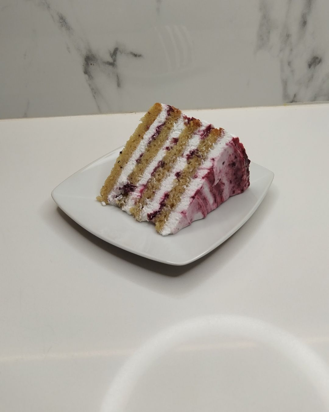Whipped Cream & Mixed Berry Compote Cake Slice