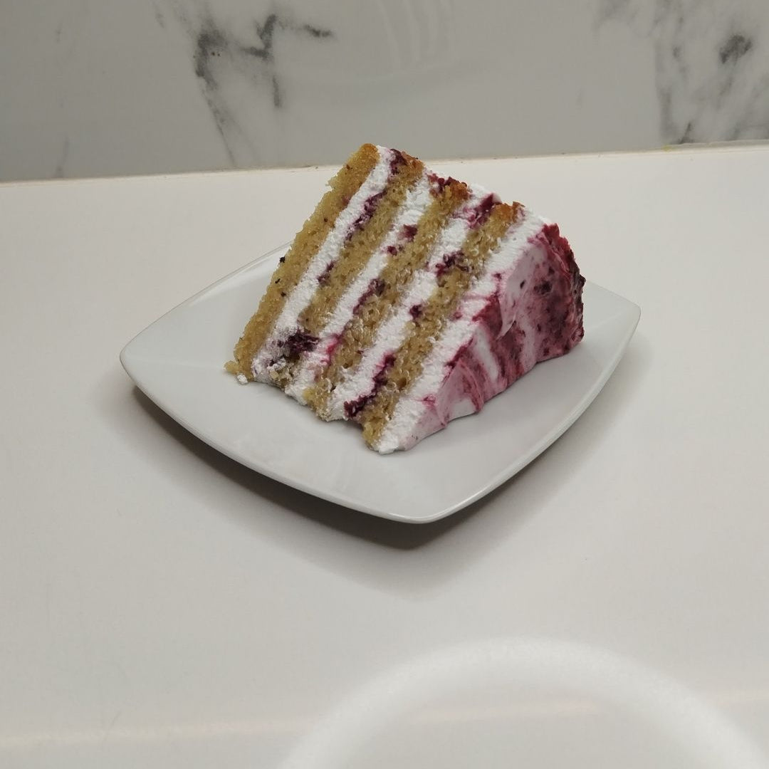Whipped Cream & Mixed Berry Compote Cake Slice