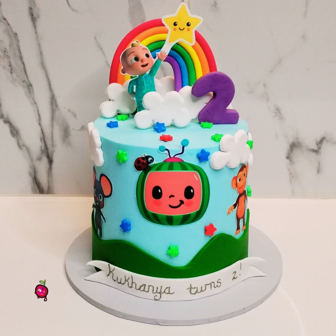 Mini Cocomelon with a Rainbow Birthday Cake