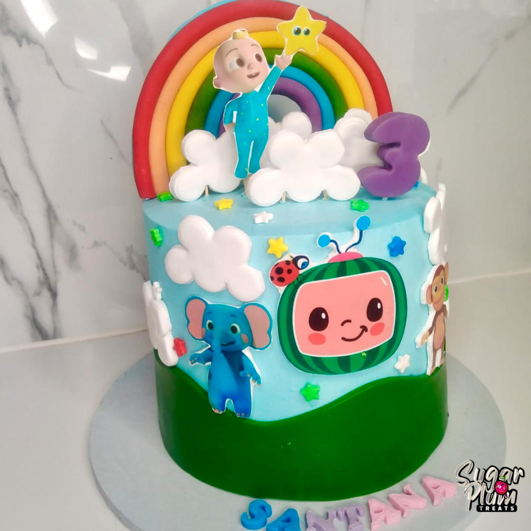 Cocomelon with a Rainbow Birthday Cake