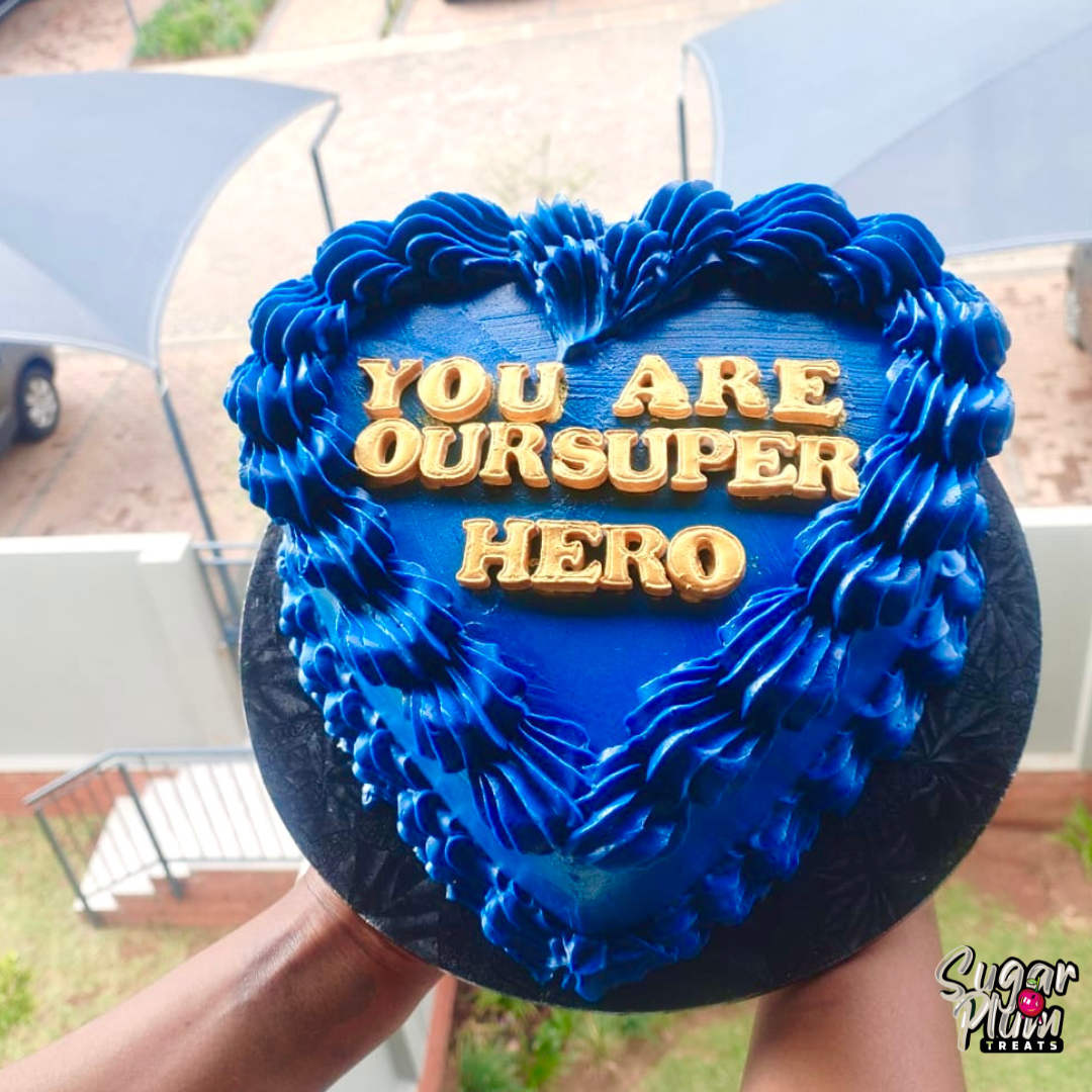 “You are our superhero ” Heart Cake