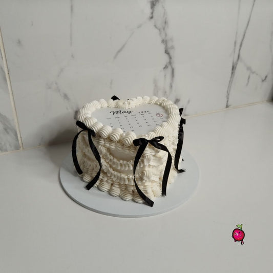 White & Black Vintage Burn-Away Heart Cake with Black Ribbons