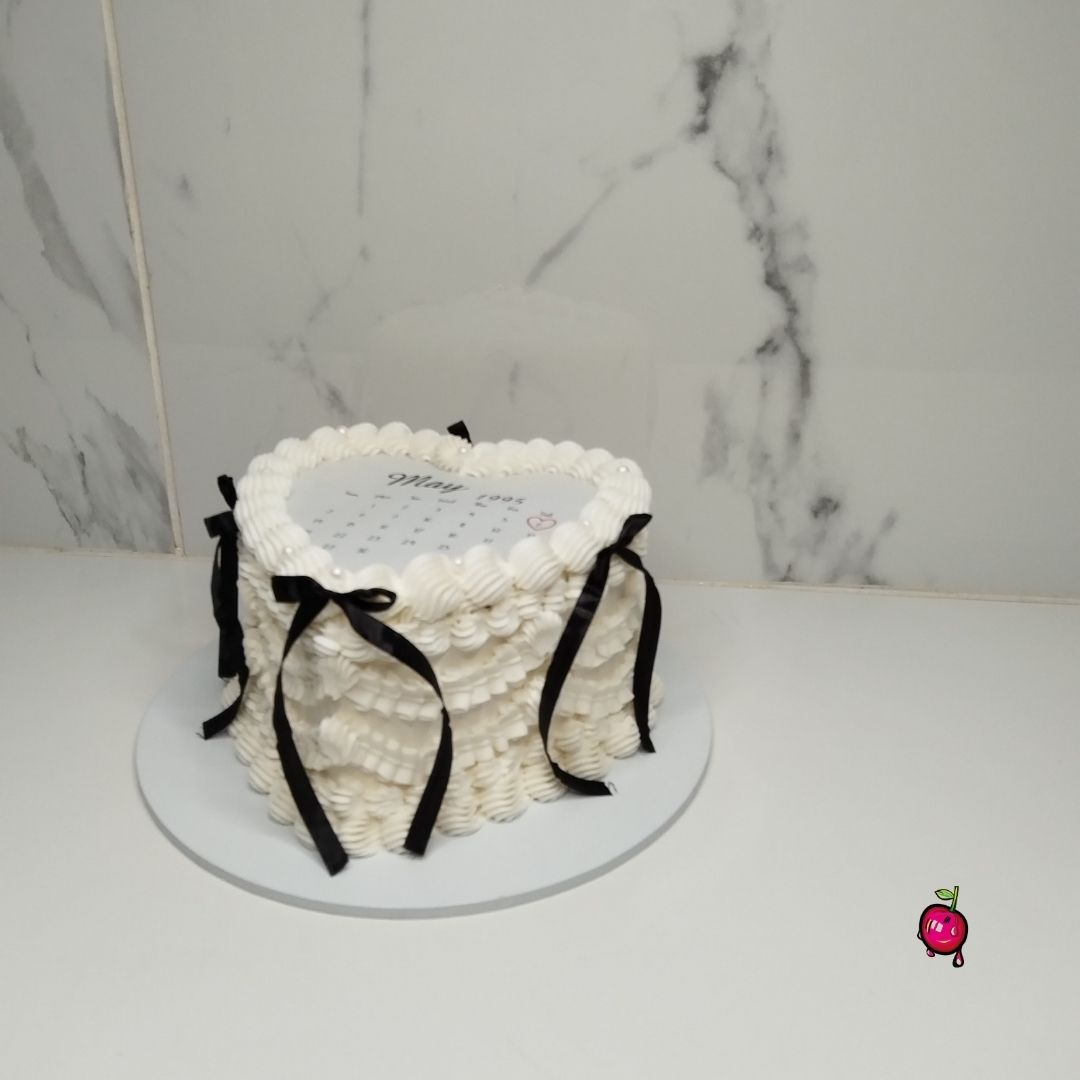 White & Black Vintage Burn-Away Heart Cake with Black Ribbons
