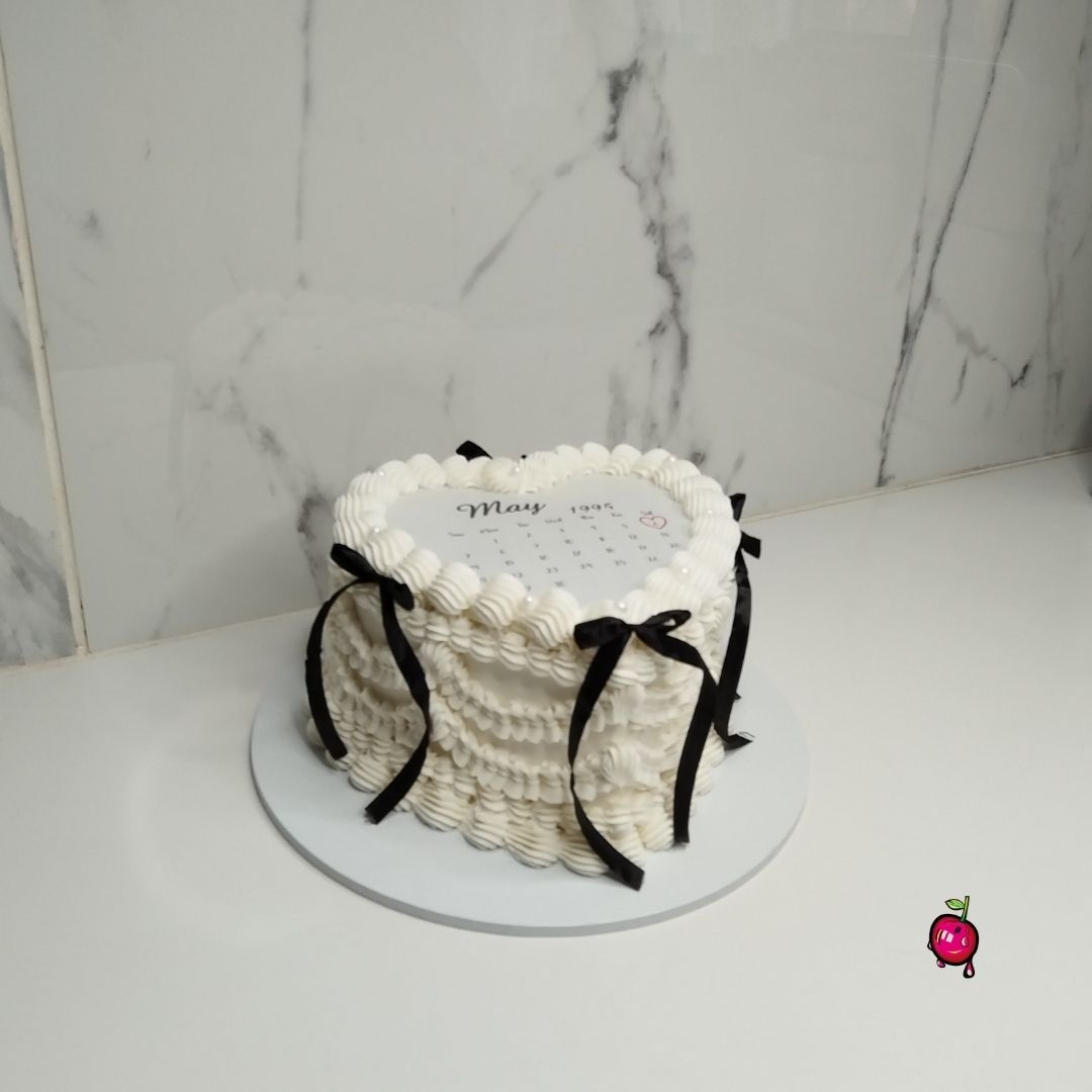 White & Black Vintage Burn-Away Heart Cake with Black Ribbons