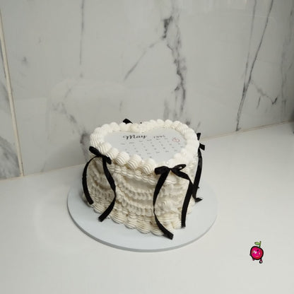 White & Black Vintage Burn-Away Heart Cake with Black Ribbons