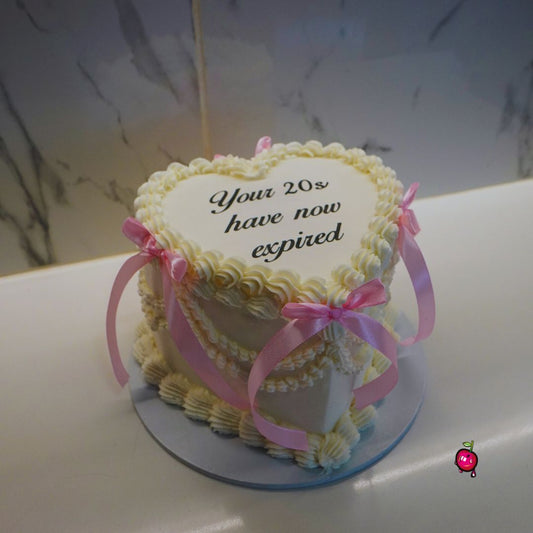 Your 20's Have now Expired Burn-away Heart Cake with Ribbons.